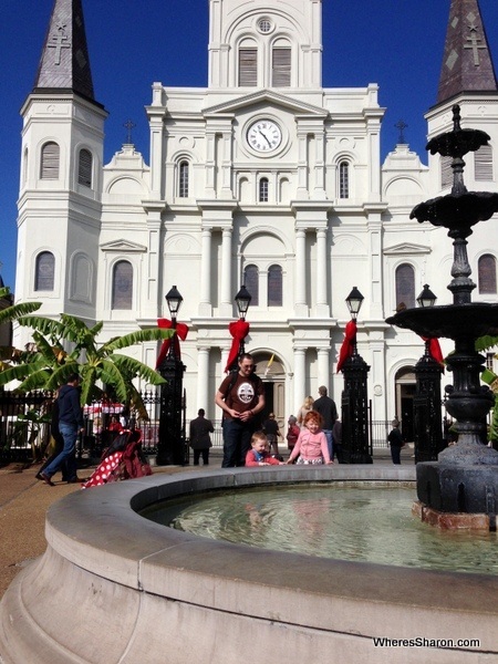 Family enjoying Jackson Square with St Louis Cathedral in the background